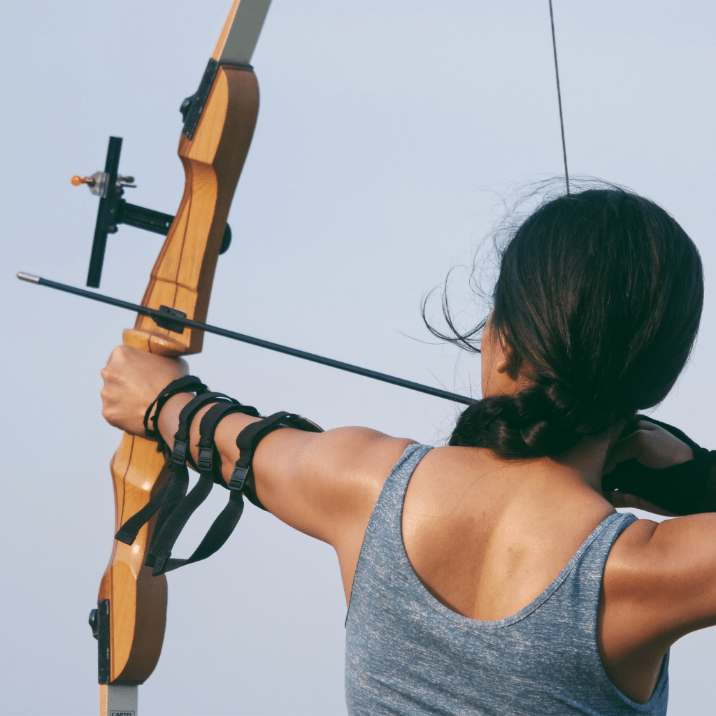 woman shooting a recurve bow